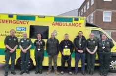 EEAST ambulance crew, Environment Agency officers and trainer stood in front of EEAST ambulance