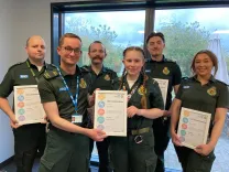 EEAST staff receiving commendations certificate