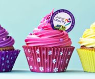 Pink cupcake with a I'm supporting my local ambulance service.