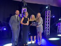 Keri Drury, EOC Retention, Health and Wellbeing Coordinator, collects the John Gilhooly Award
