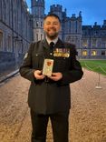 Sergeant Gareth Jones with his MBE at Windsor Castle