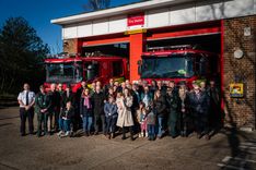 Members of Rod Taylor's family unveiling the AED outside Royston Fire Station