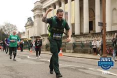 Luke in ambulance kit and carrying a responder bag in the Cambridge Half Marathon