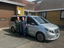 A male paramedic and female mental health nurse in front of the Mental Health Response Vehicle