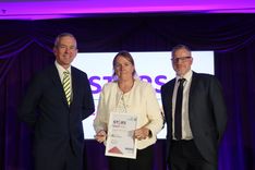 Mandy Chapman receiving her Volunteer of the Year award from Neill Moloney and Steven Course