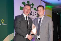 Marcus Turner-Leeper receiving the Outstanding Service Award from AACE chair Jason Killens KAM