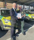 A member of East of England Ambulance Service has been given a bravery award after grabbing a girl teetering on a tiny ledge over the A47. 