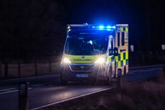 EEAST ambulance driving at night with lights flashing