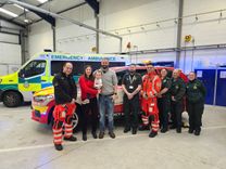 Richard Bowes with ambulance crews and medics at West Herts ambulance station