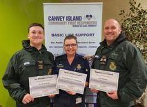 Three Canvey Island community first responders standing with their certificates