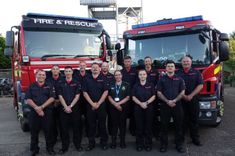 cromer fire station team standing in front of two stationery fire engines 