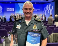 Ron Ridge with his award and certificate